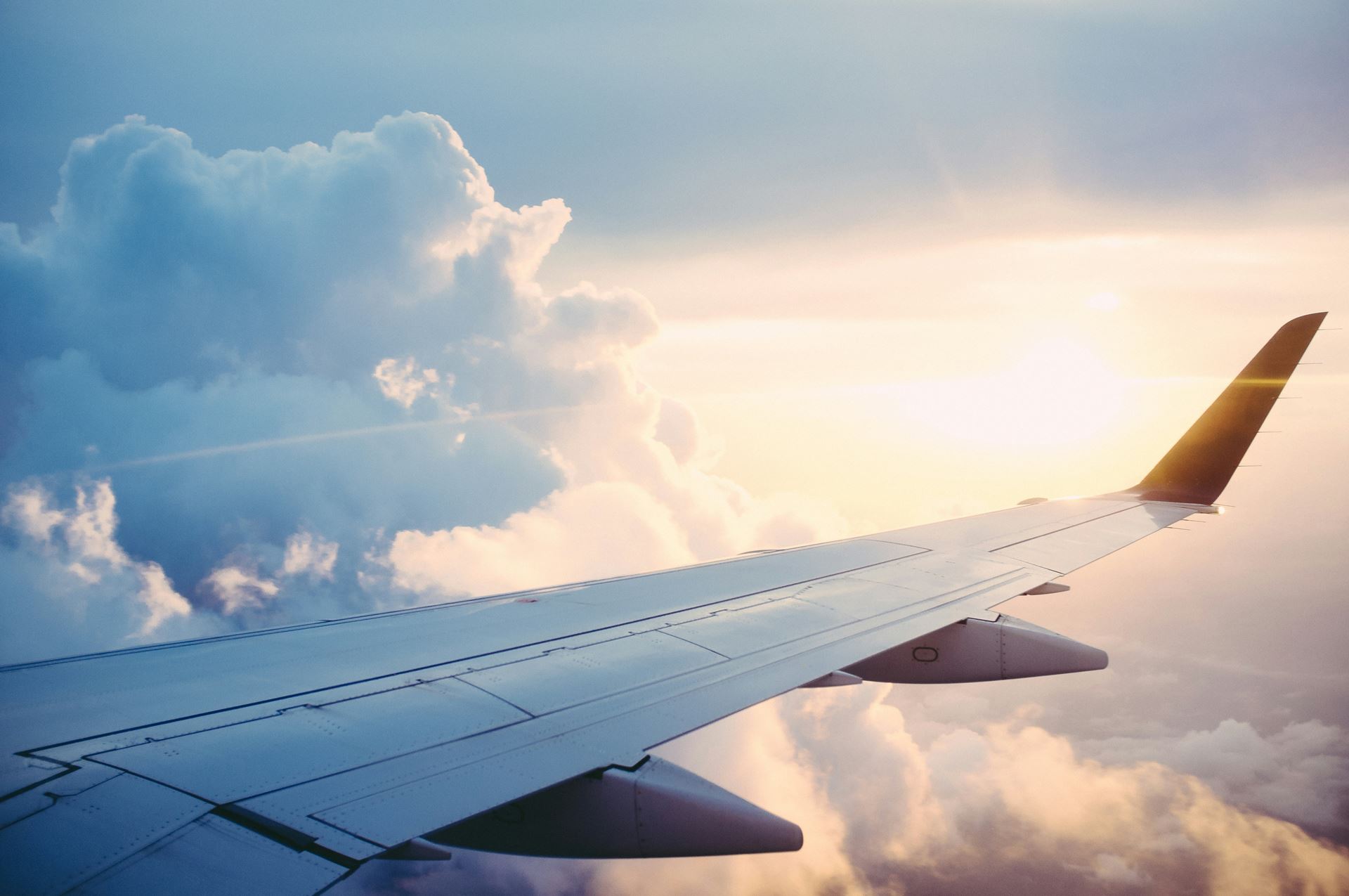 Wing of a plane in the clouds